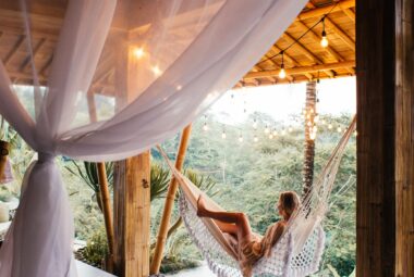 Woman relaxing in exotic location in-hammock