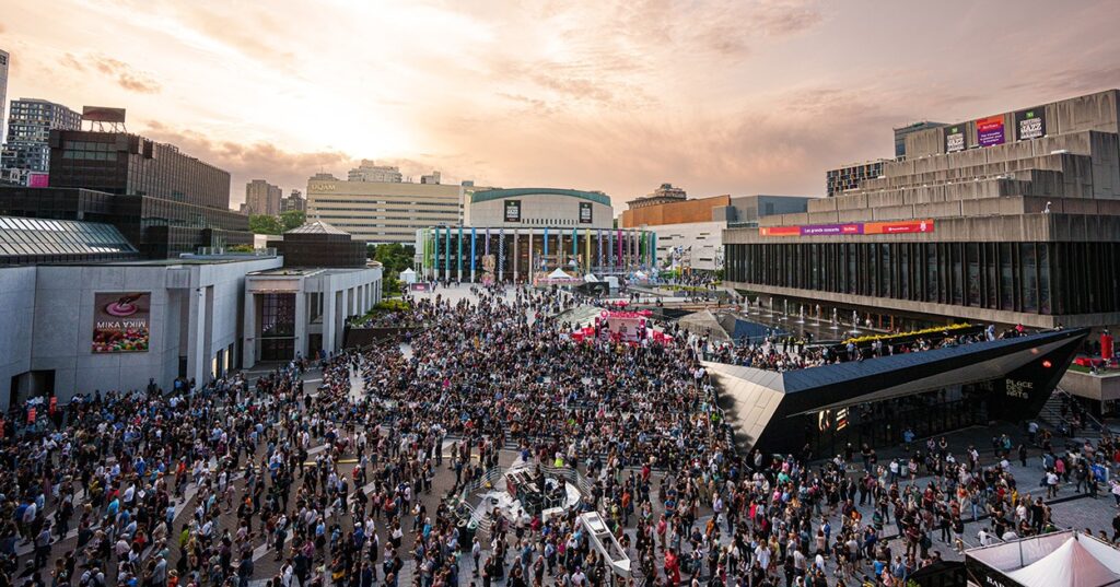 Montreal International Jazz Festival - Jun 2023 - overhead shot showing massive crowd of festival goers
